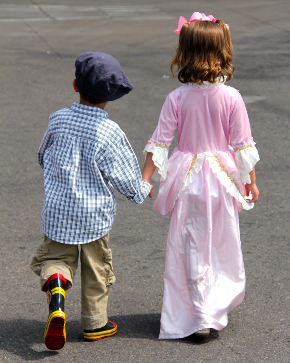 Young Emma and Chase walking hand-in-hand