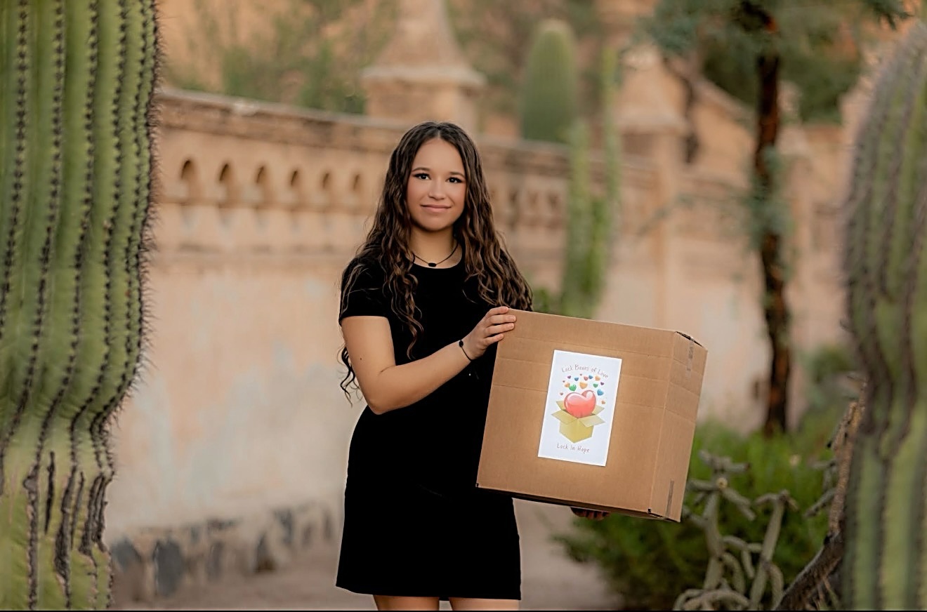 Emma holding a Lock Box of Love